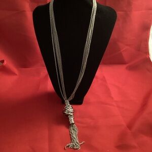 Long silver tone metallic with a big node necklace